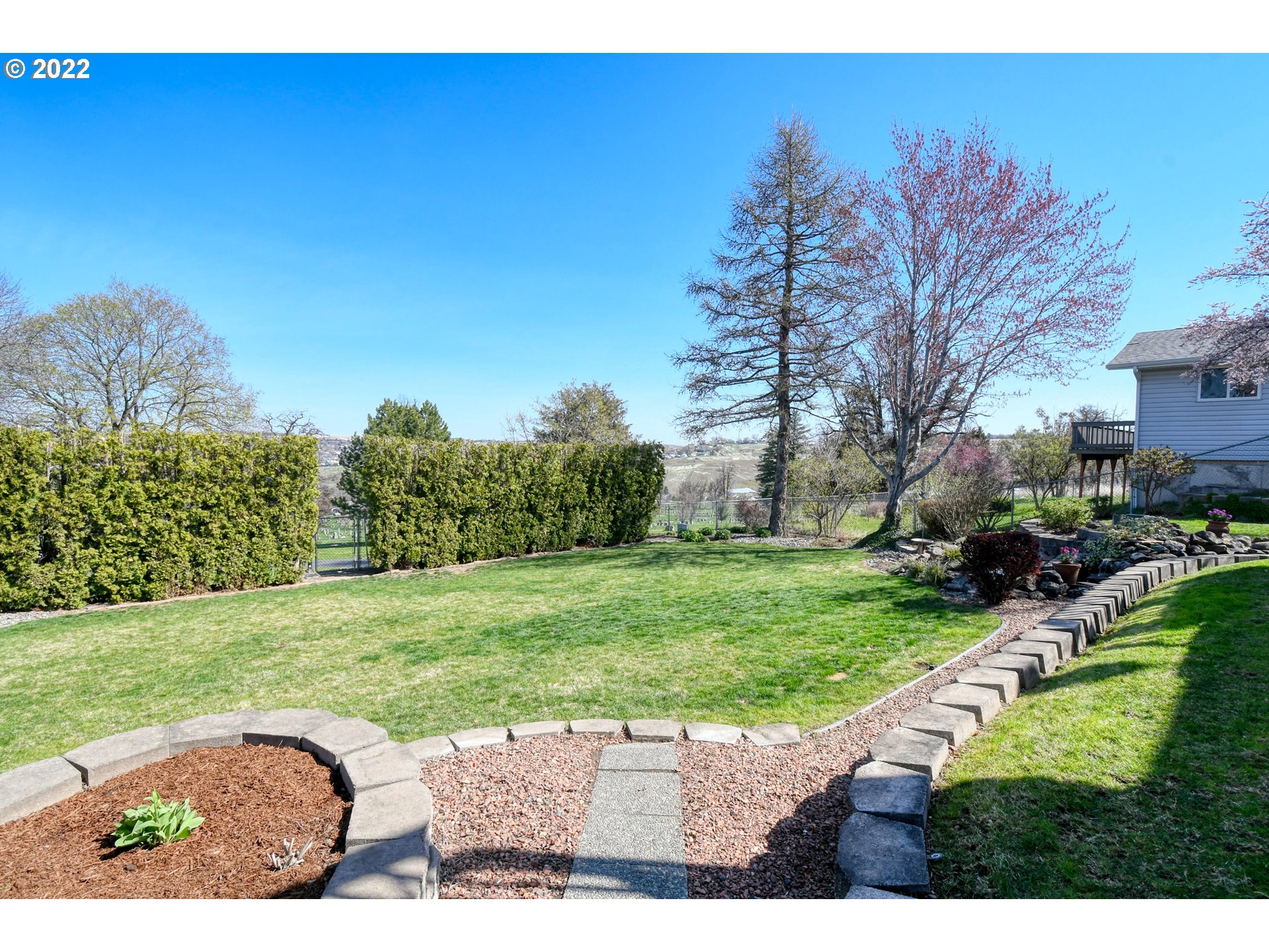 2209 Southwest Ladow Avenue Pendleton, OR 97801 - Photo 3 of 24 a view of a garden with a building