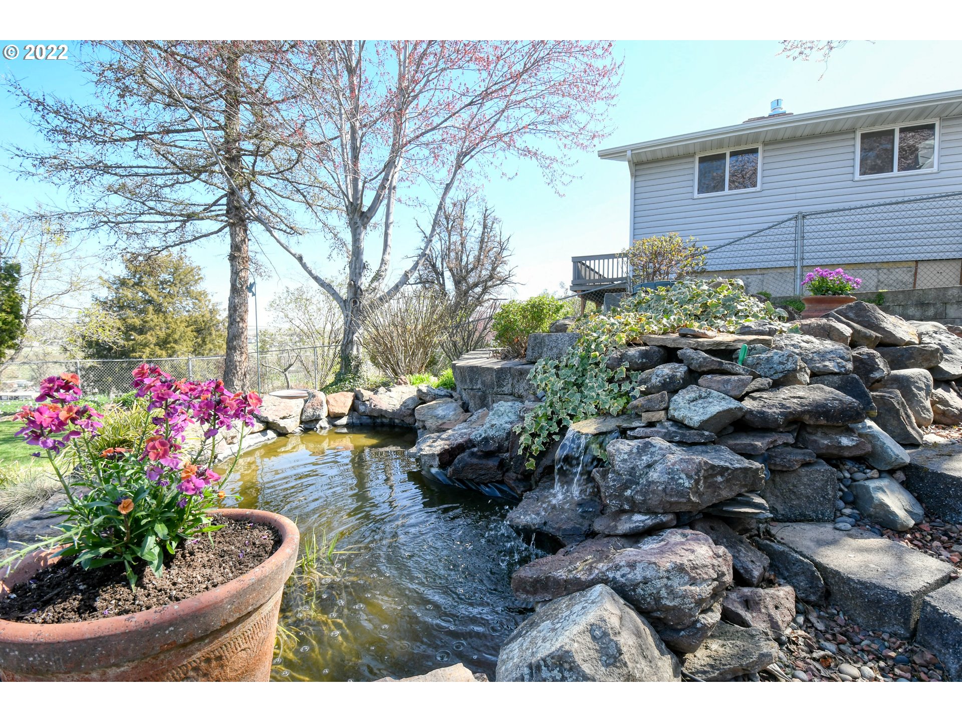 2209 Southwest Ladow Avenue Pendleton, OR 97801 - Photo 7 of 24 a view of a backyard with potted plants