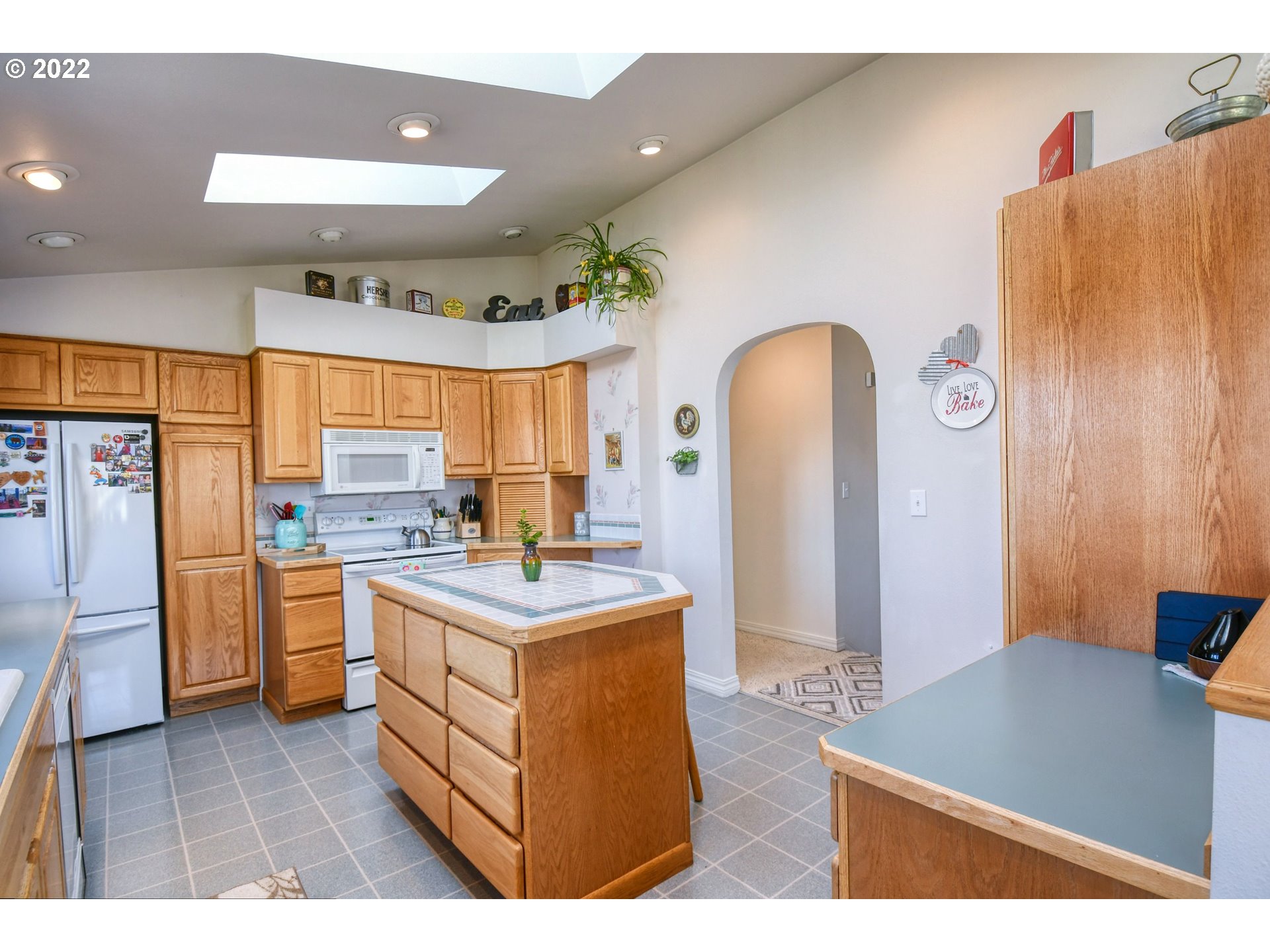 2209 Southwest Ladow Avenue Pendleton, OR 97801 - Photo 10 of 24 a kitchen with stainless steel appliances granite countertop a stove a sink and a refrigerator