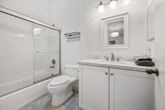 a bedroom with a bed and a table