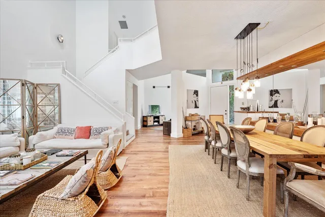 a living room with lots of furniture and a chandelier