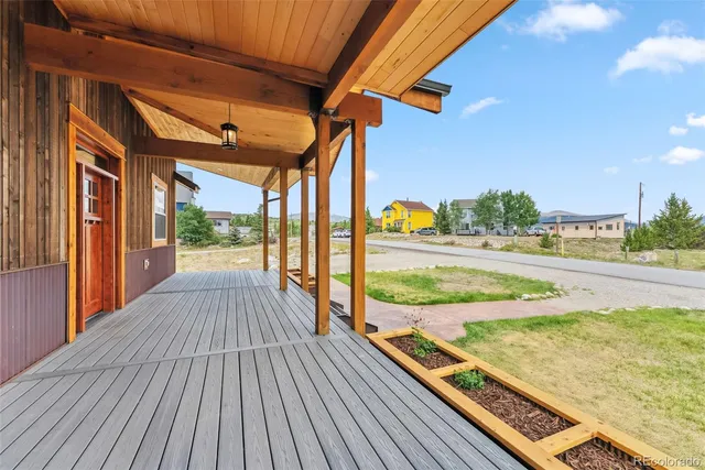 a view of a balcony with wooden floor