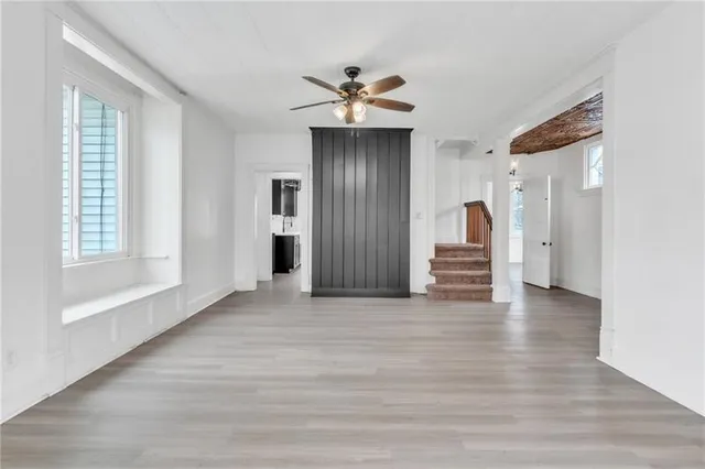 a view of an empty room with a window