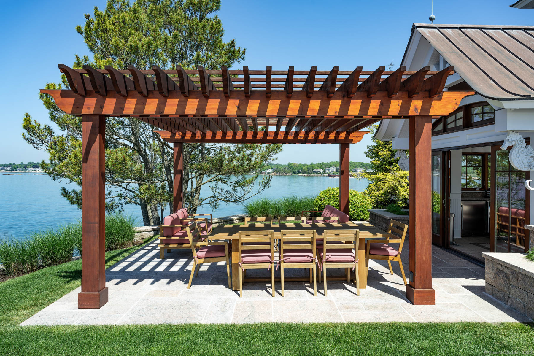 Rogers Island Branford, CT 06405 - Photo 22 of 40 a patio with a yard table and chairs