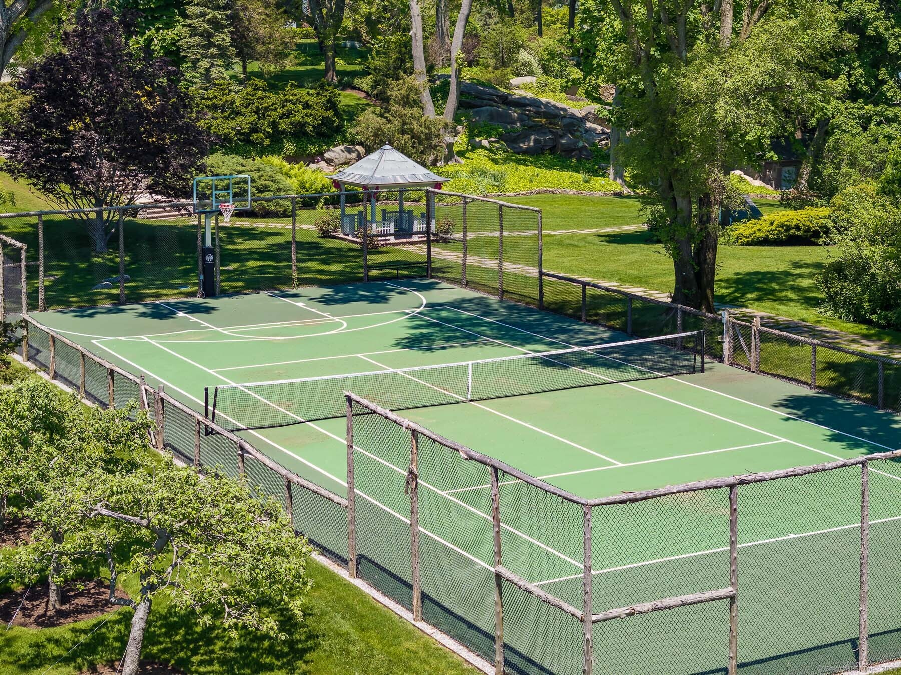 Rogers Island Branford, CT 06405 - Photo 25 of 40 a view of a tennis ground with large trees