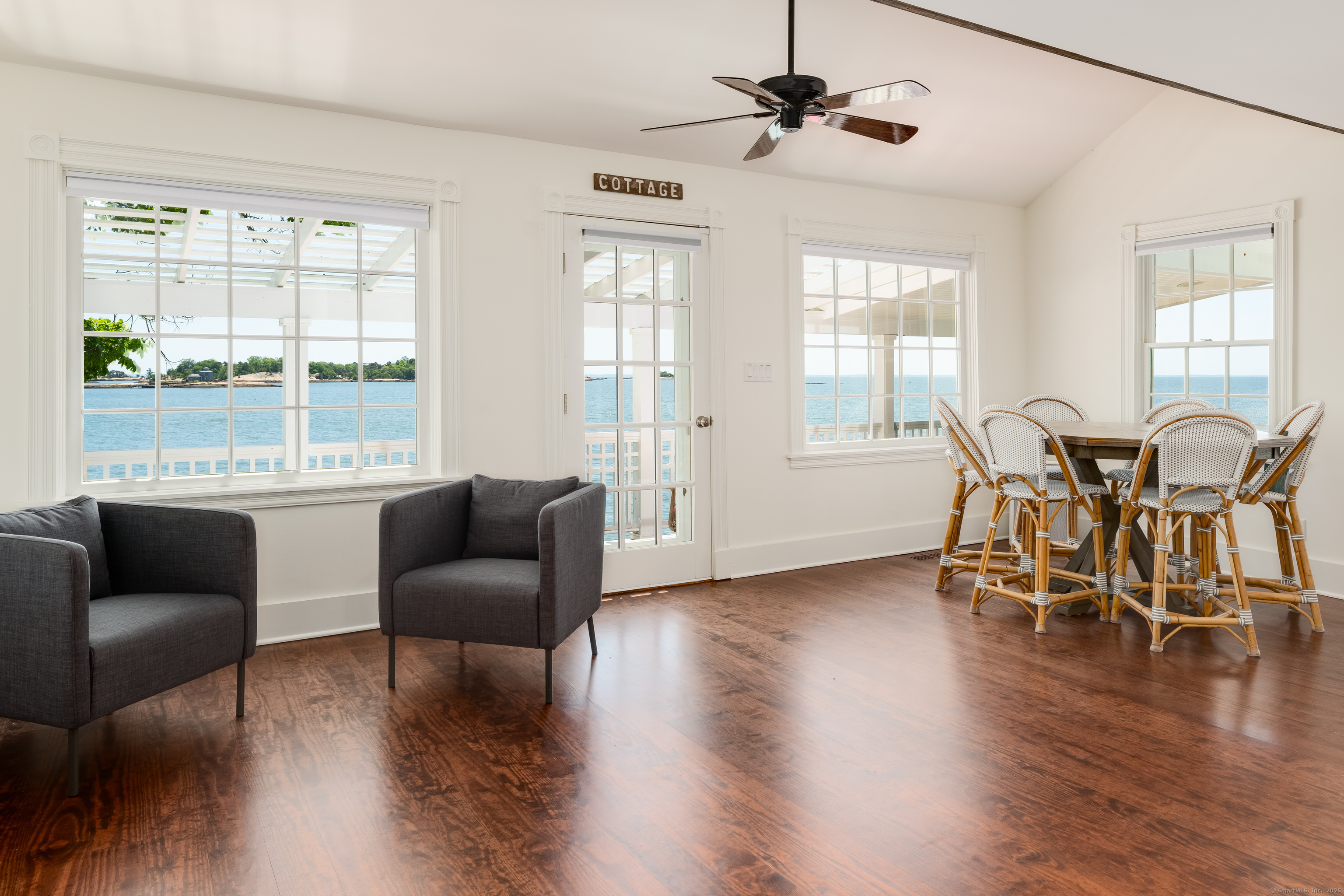 Rogers Island Branford, CT 06405 - Photo 26 of 40 a living room with furniture and a large window