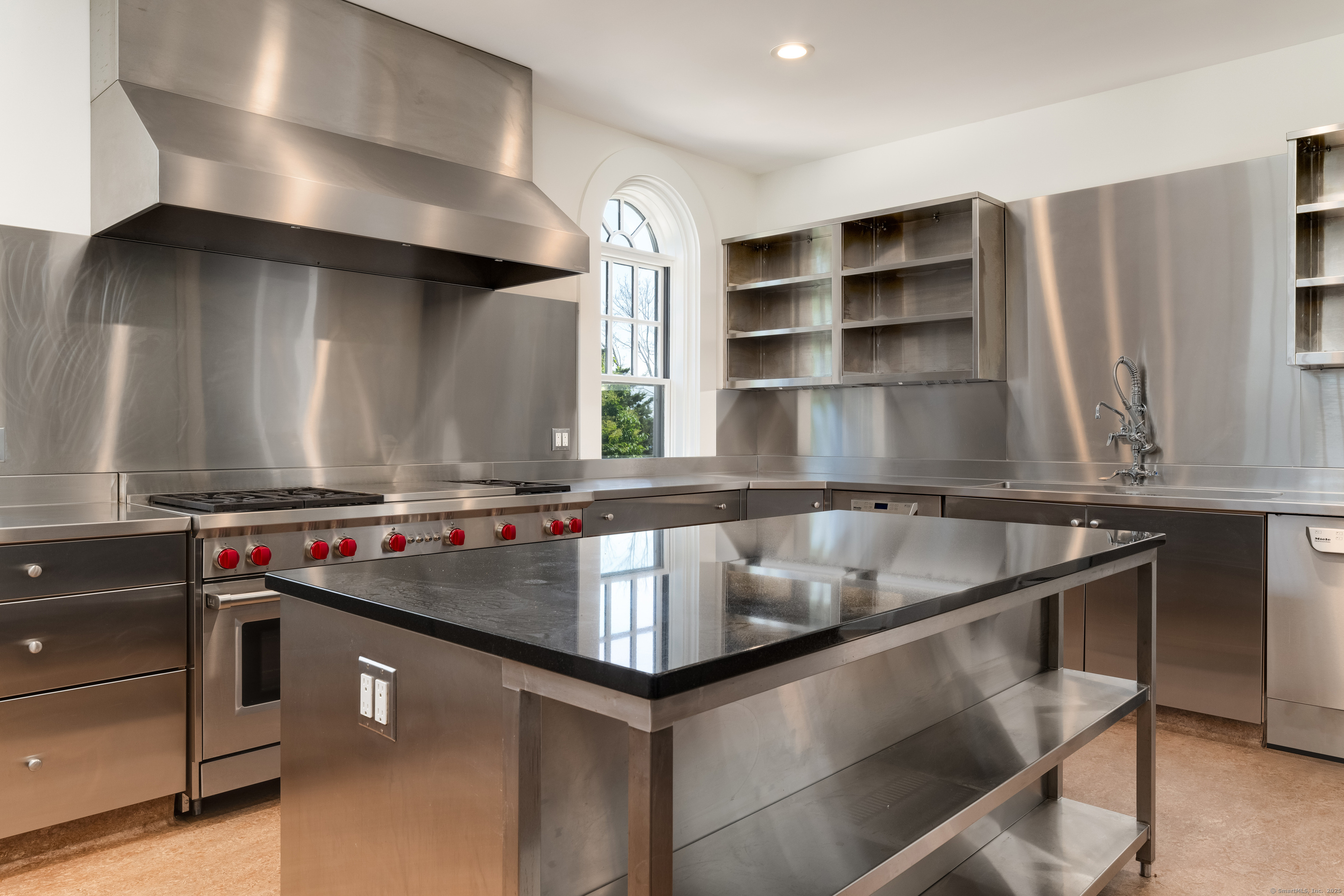 Rogers Island Branford, CT 06405 - Photo 8 of 40 a kitchen with kitchen island a stove and a sink