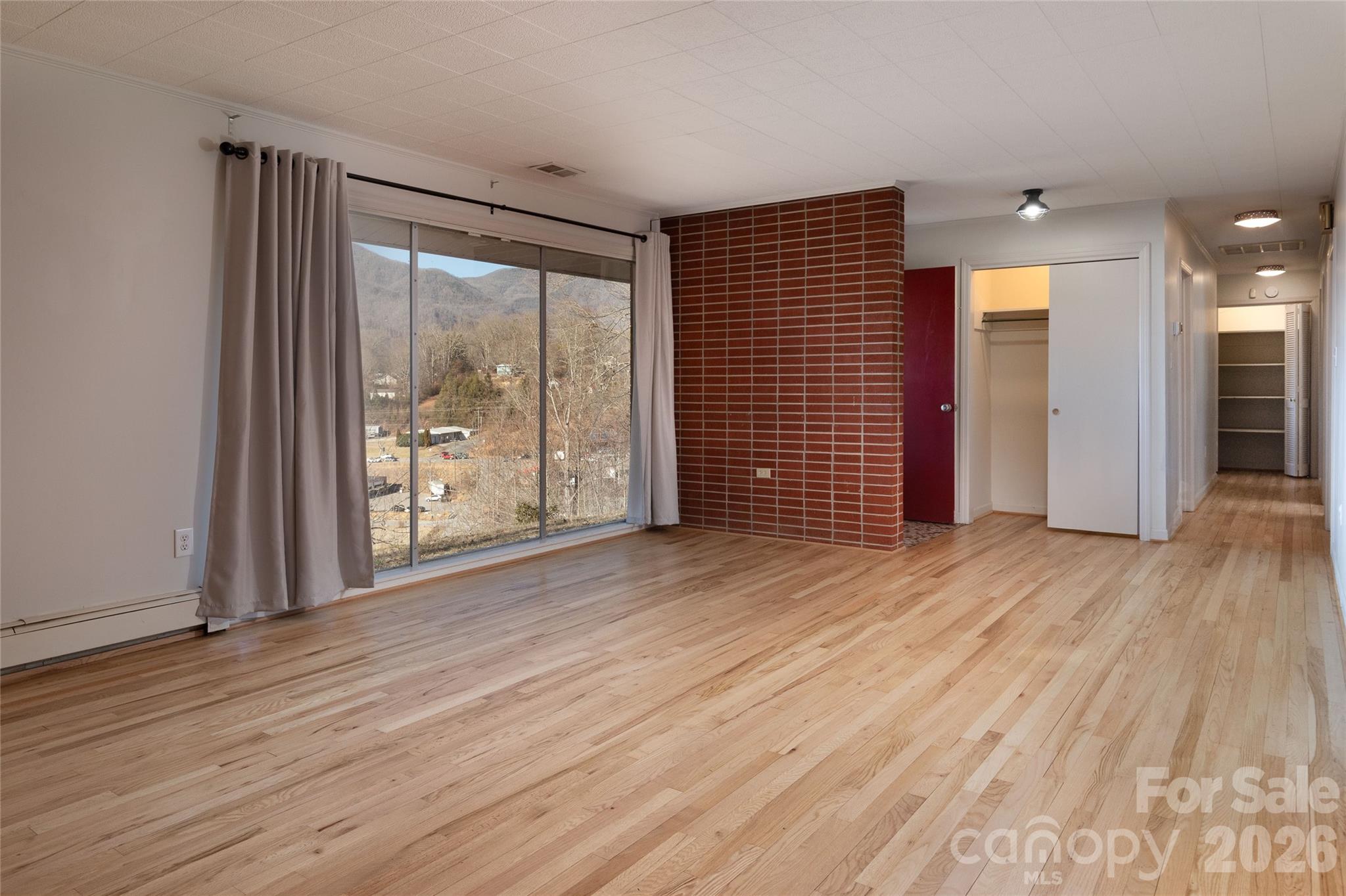 223 Cherry Street Sylva, NC 28779 - Photo 13 of 29 wooden floor and windows in a room