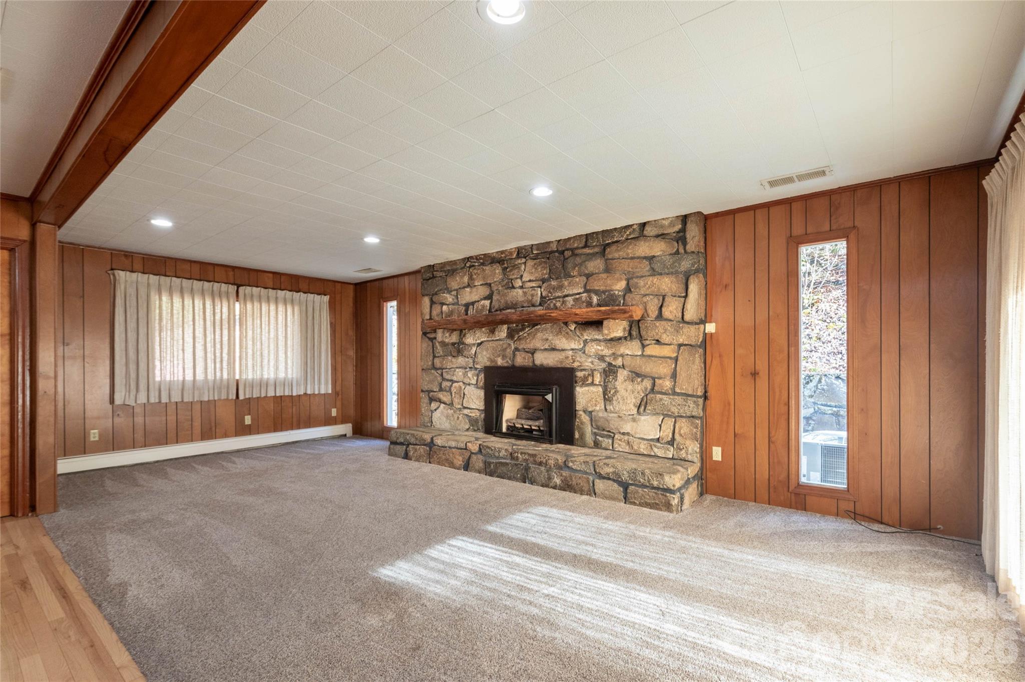 223 Cherry Street Sylva, NC 28779 - Photo 21 of 29 an empty room with windows and fireplace