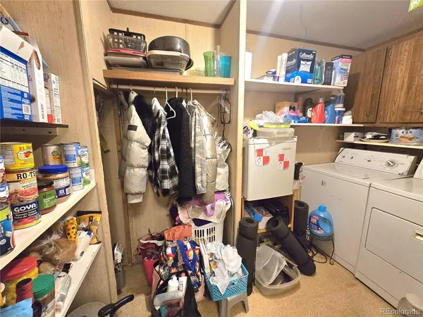a utility room with dryer washer and other items