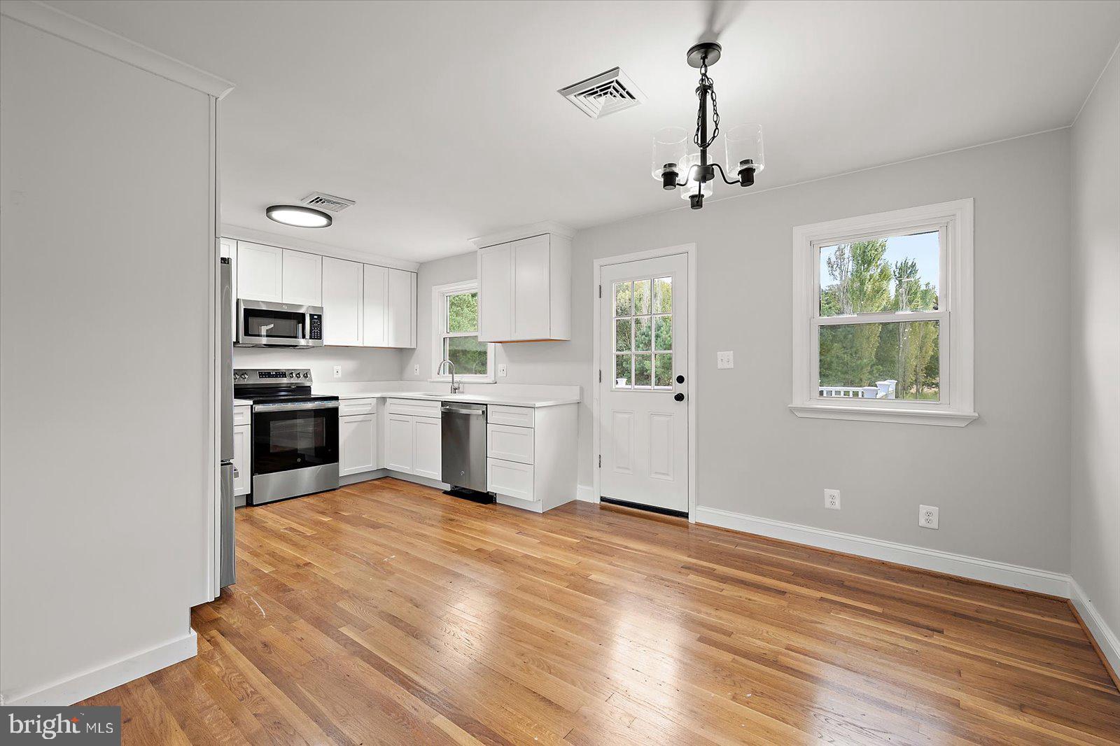 31655 Morris Leonard Road Parsonsburg, MD 21849 - Photo 24 of 90 a view of kitchen with granite countertop stainless steel appliances cabinets a sink and a window