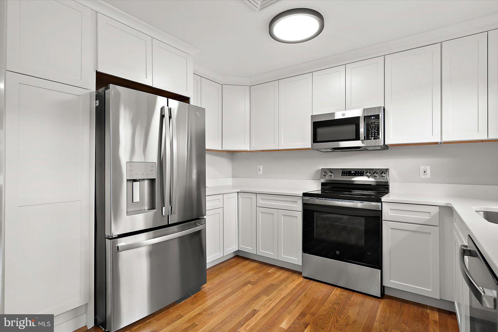 31655 Morris Leonard Road Parsonsburg, MD 21849 - Photo 26 of 90 a kitchen with a refrigerator stove and microwave