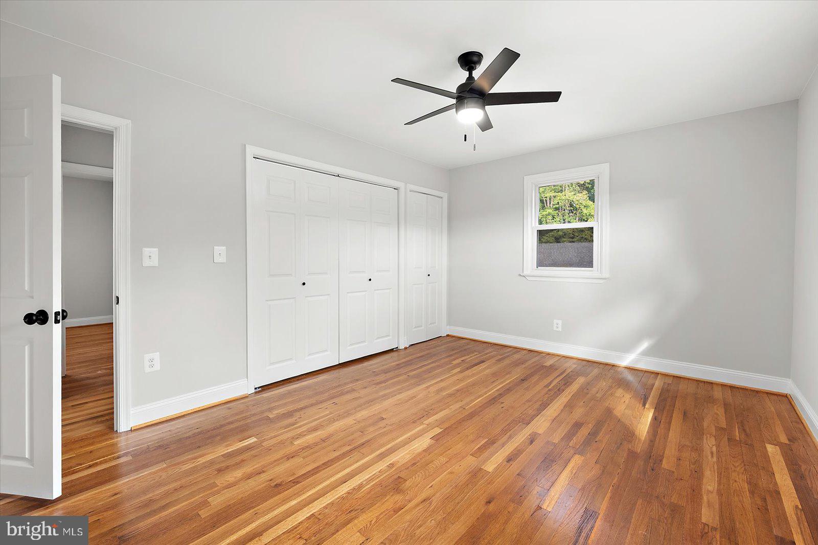 31655 Morris Leonard Road Parsonsburg, MD 21849 - Photo 33 of 90 an empty room with wooden floor and windows