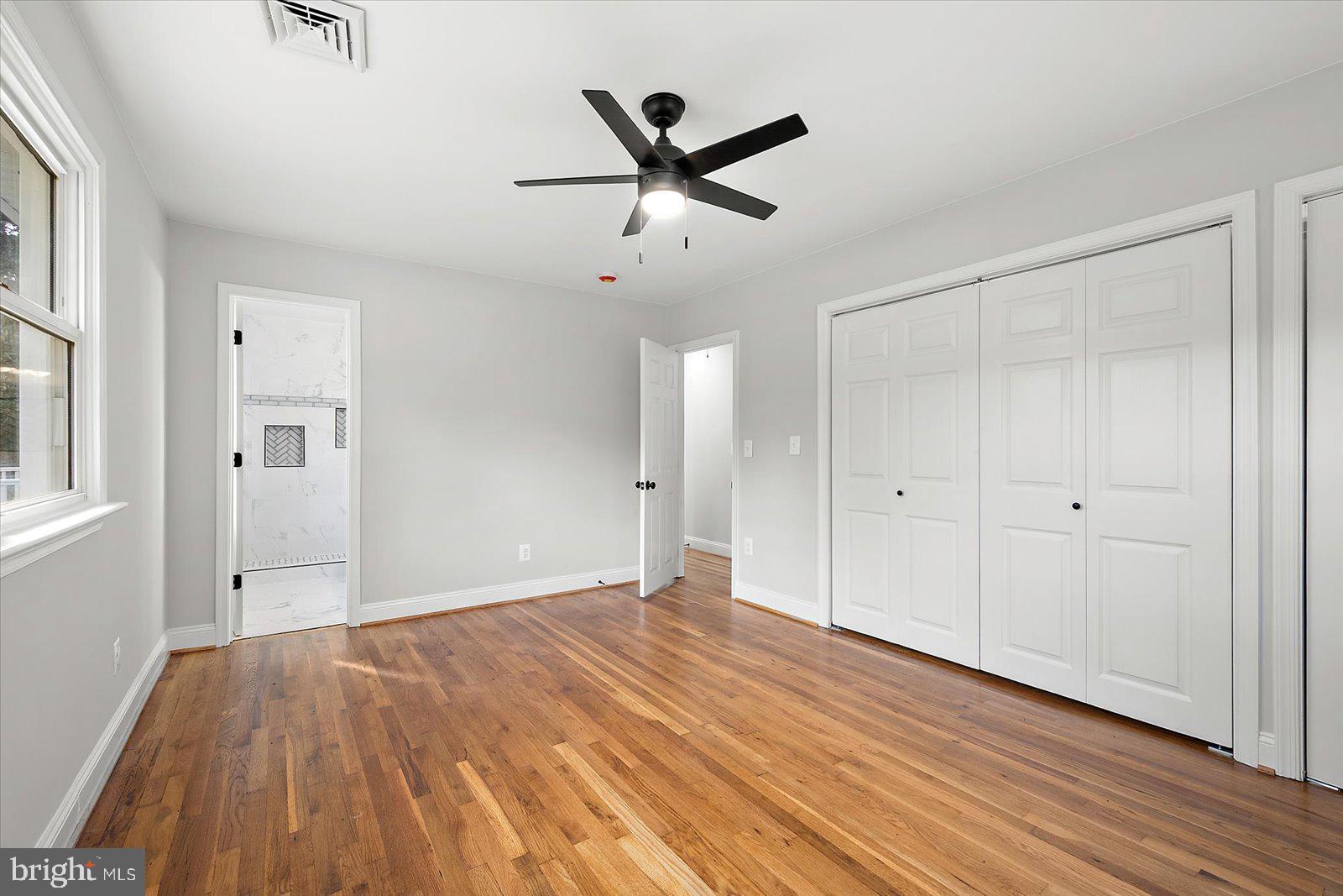 31655 Morris Leonard Road Parsonsburg, MD 21849 - Photo 34 of 90 a view of empty room with wooden floor and ceiling fan