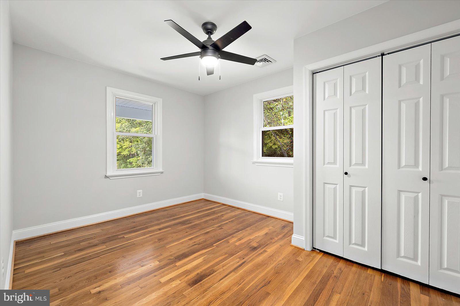31655 Morris Leonard Road Parsonsburg, MD 21849 - Photo 36 of 90 wooden floor in an empty room with a window