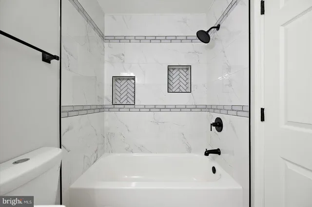 a view of house with outdoor space and sitting area