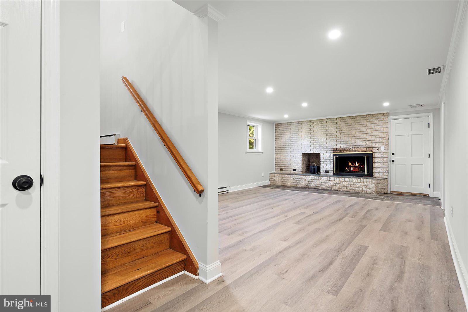 31655 Morris Leonard Road Parsonsburg, MD 21849 - Photo 43 of 90 a view of an empty room with wooden floor and stairs