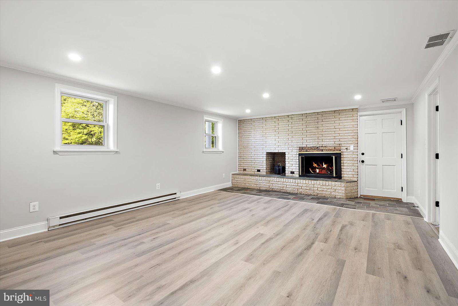 31655 Morris Leonard Road Parsonsburg, MD 21849 - Photo 44 of 90 a view of empty room with a fireplace and wooden floor