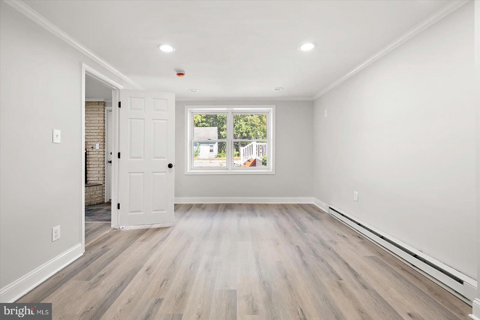 31655 Morris Leonard Road Parsonsburg, MD 21849 - Photo 50 of 90 wooden floor in an empty room with a window