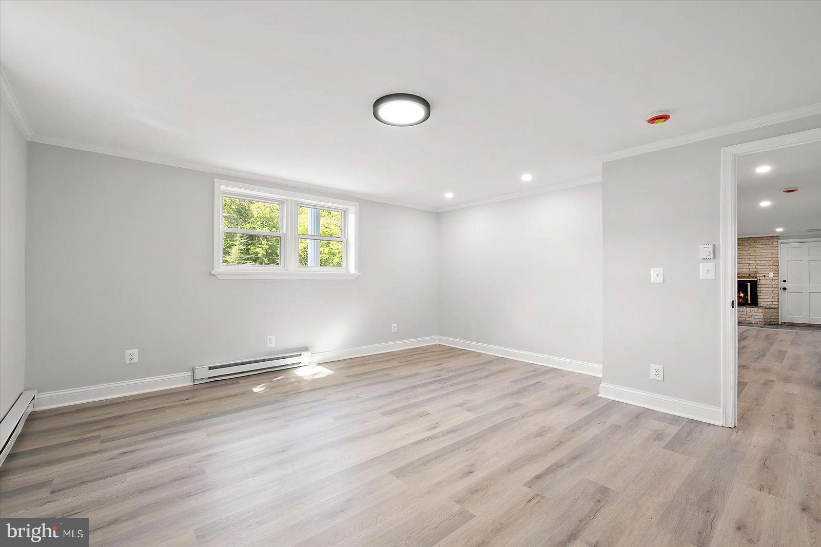 31655 Morris Leonard Road Parsonsburg, MD 21849 - Photo 53 of 90 an empty room with wooden floor and windows