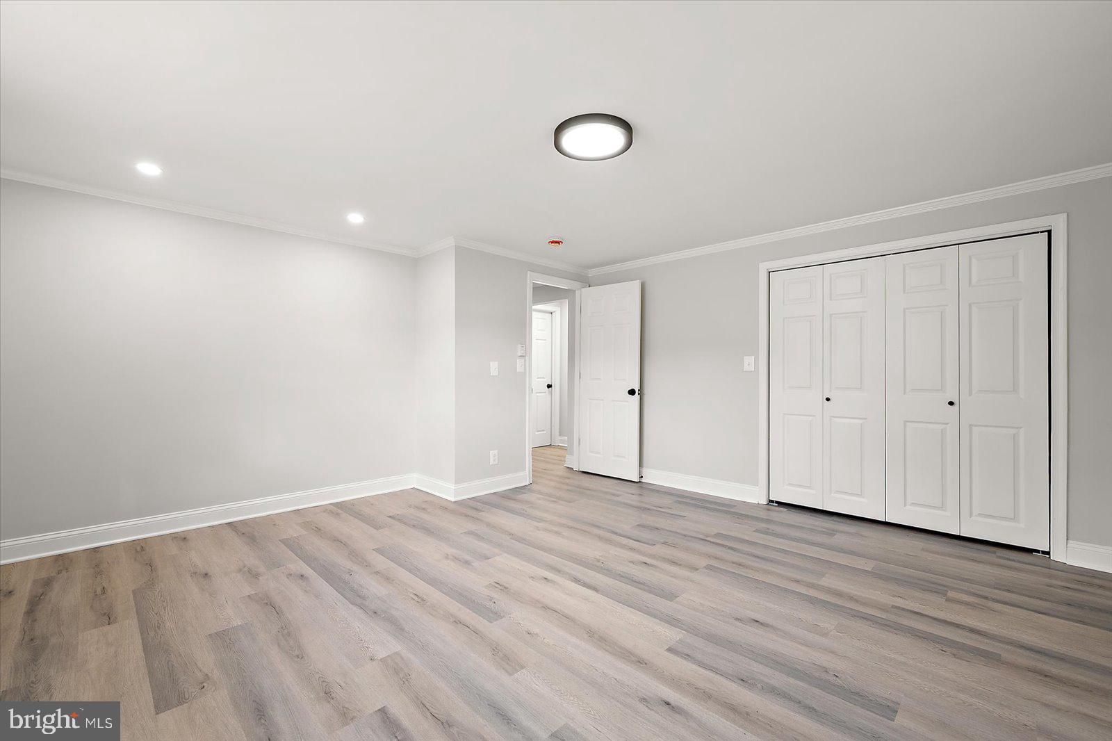 31655 Morris Leonard Road Parsonsburg, MD 21849 - Photo 54 of 90 a view of an empty room with wooden floor