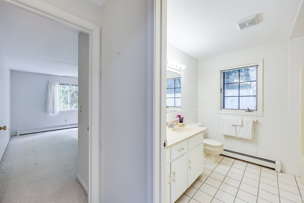 103 Dory Circle Barnstable, MA 02648 - Photo 21 of 42 a spacious bathroom with a sink a mirror and a bathtub