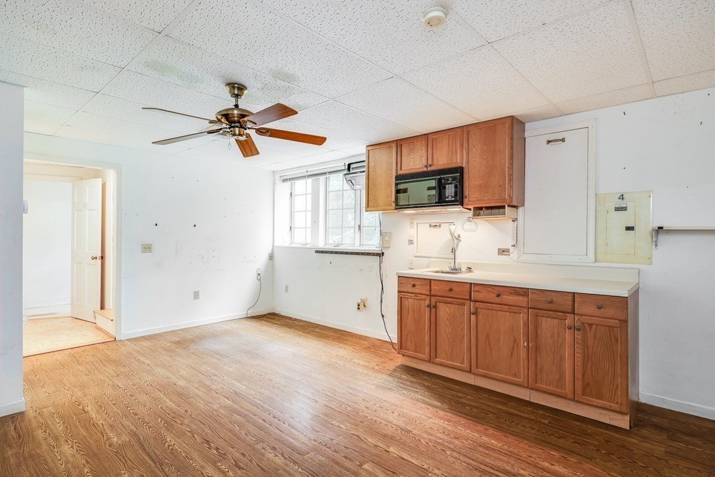 103 Dory Circle Barnstable, MA 02648 - Photo 30 of 42 a kitchen with granite countertop a stove a sink and a refrigerator