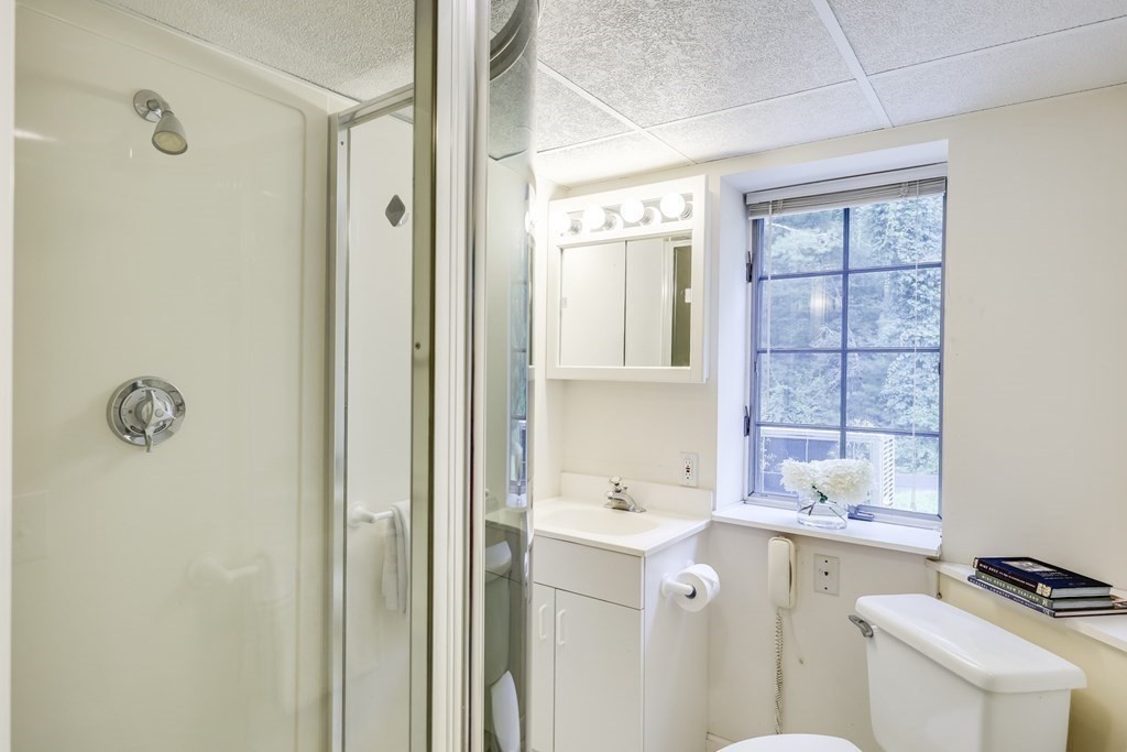 103 Dory Circle Barnstable, MA 02648 - Photo 31 of 42 a bathroom with a sink toilet and shower