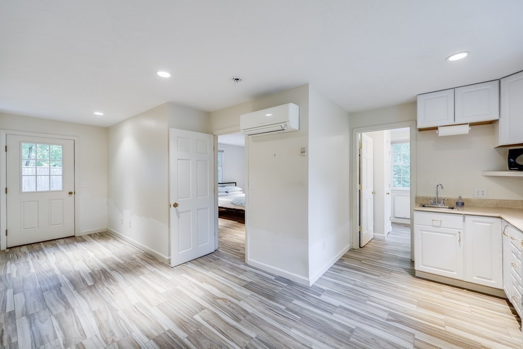 103 Dory Circle Barnstable, MA 02648 - Photo 33 of 42 a view of a kitchen with wooden floor and a sink