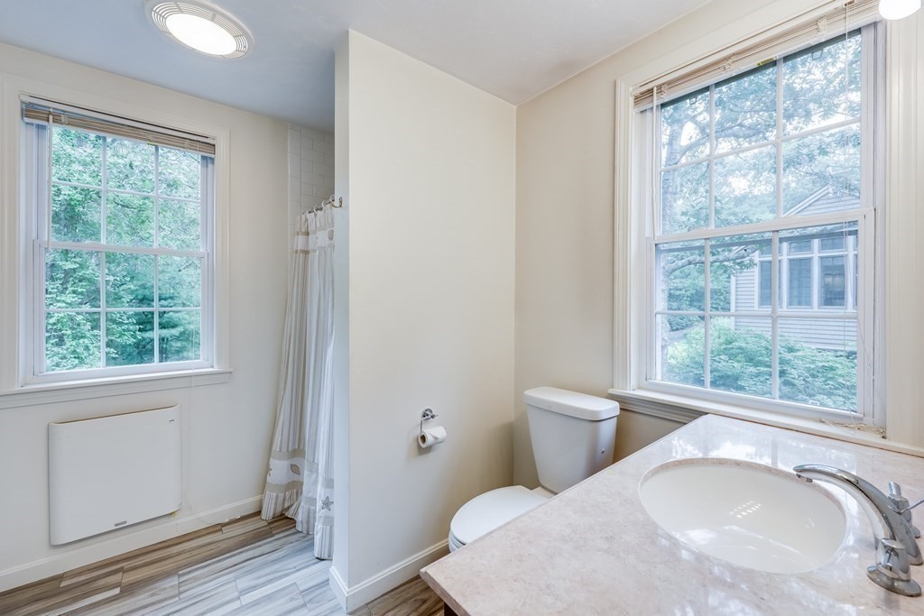 103 Dory Circle Barnstable, MA 02648 - Photo 35 of 42 a view of a bedroom with wooden floor and a window