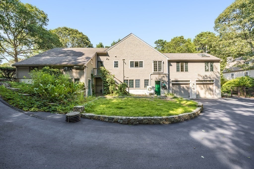 103 Dory Circle Barnstable, MA 02648 - Photo 38 of 42 a front view of a house with a yard and shrubs