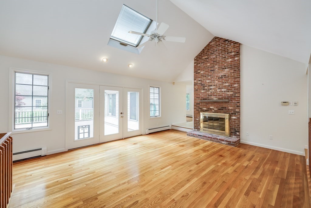 103 Dory Circle Barnstable, MA 02648 - Photo 7 of 42 an empty room with wooden floor and windows