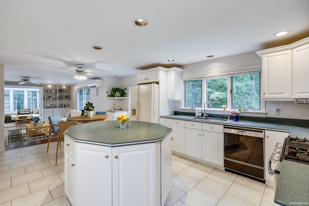 103 Dory Circle Barnstable, MA 02648 - Photo 10 of 42 a kitchen with a sink stove and cabinets