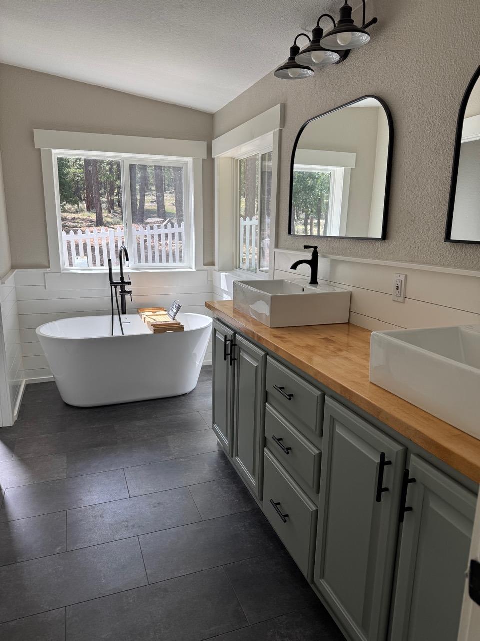 4678 Portola McLears Road Clio, CA 96106 - Photo 18 of 33 a spacious bathroom with a double vanity sink mirror and bathtub