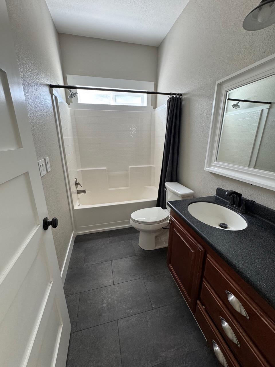 4678 Portola McLears Road Clio, CA 96106 - Photo 22 of 33 a bathroom with a granite countertop sink toilet and shower