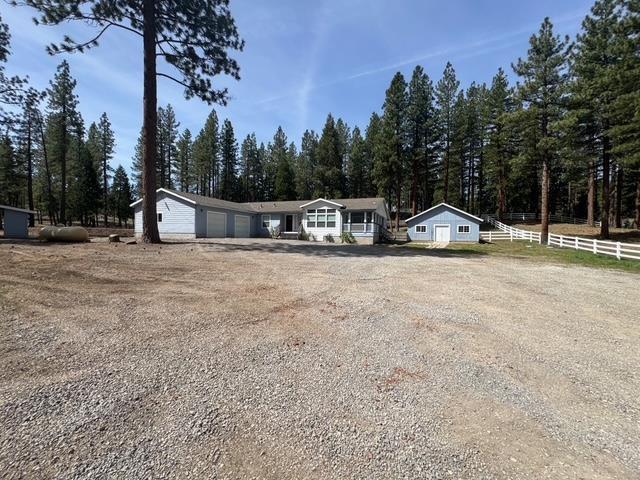4678 Portola McLears Road Clio, CA 96106 - Photo 3 of 33 a view of street with houses and trees in the background