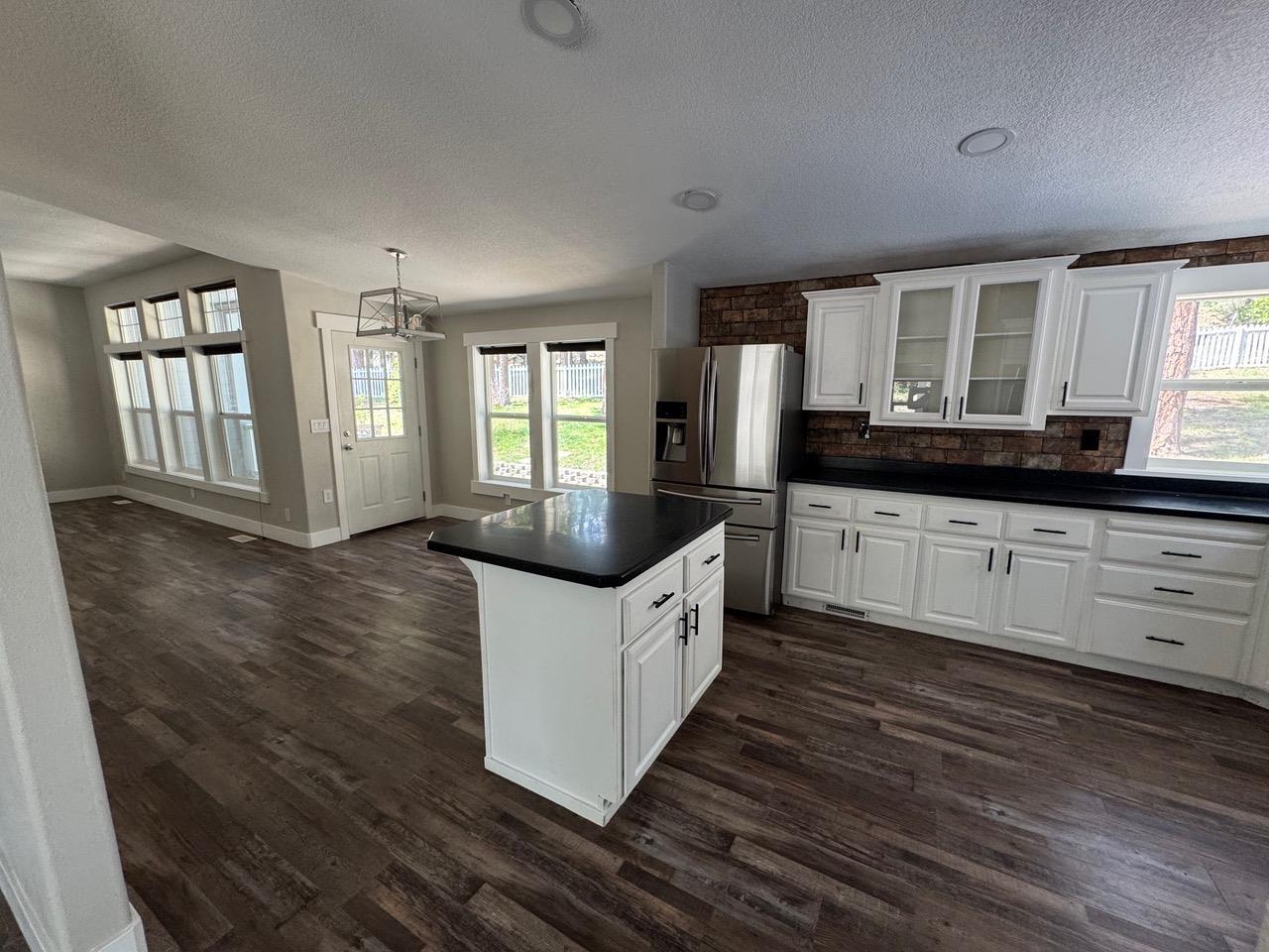 4678 Portola McLears Road Clio, CA 96106 - Photo 9 of 33 a kitchen with stainless steel appliances a sink and a large window