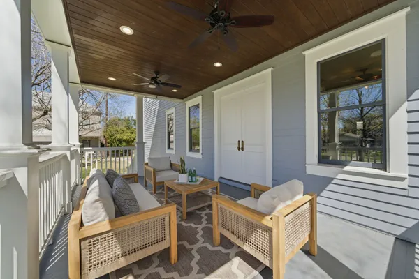 a outdoor living space with patio furniture and a potted plant