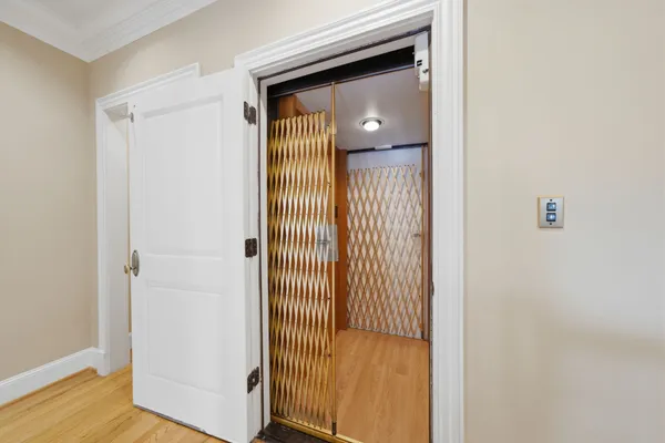 a view of a bathroom with wooden floor
