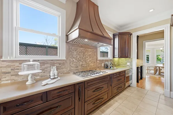 a spacious bathroom with a granite countertop sink and a mirror