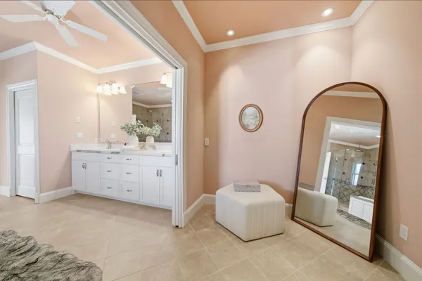 a spacious bathroom with a tub and mirror