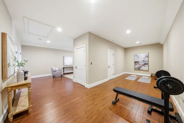 a living room with furniture a dining table and kitchen view