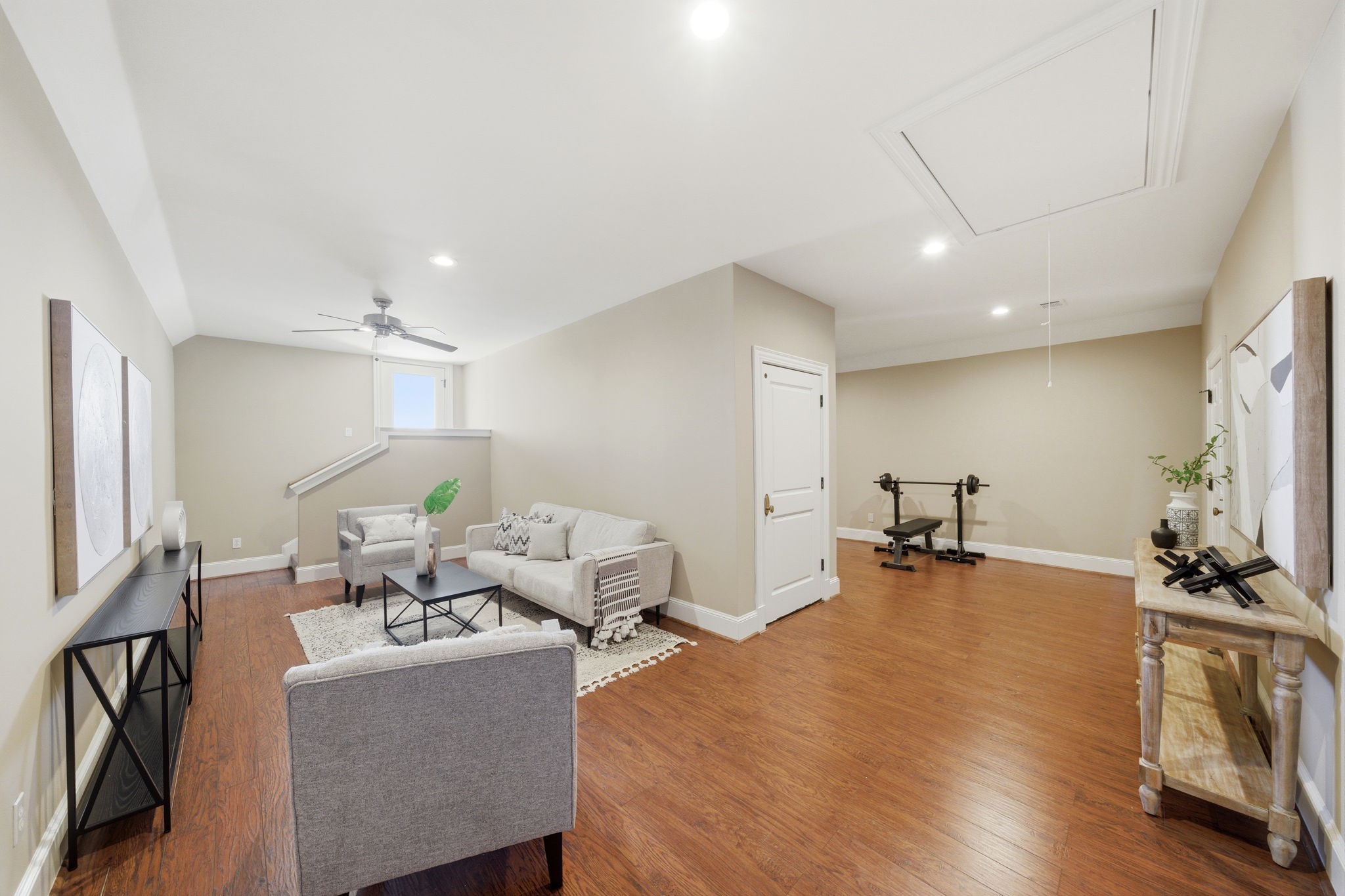607 East 15th Street Houston, TX 77008 - Photo 35 of 50 Third floor, spacious, flexible-use room (approximately 25X24) ideal for a fifth bedroom, studio, or fitness area, with 9-foot ceilings, a private front balcony, and easy access to decked attic storage. Elevator access serves all three levels
