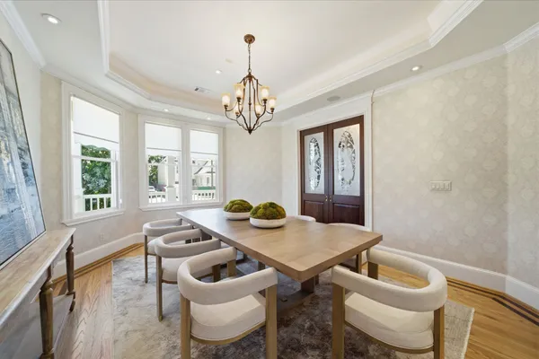 a dining room with furniture and window