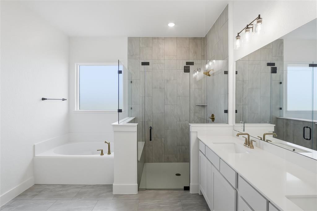 810 Vly Rdg Road Van Alstyne, TX 75495 - Photo 22 of 39 a bathroom with a tub sink shower and mirror