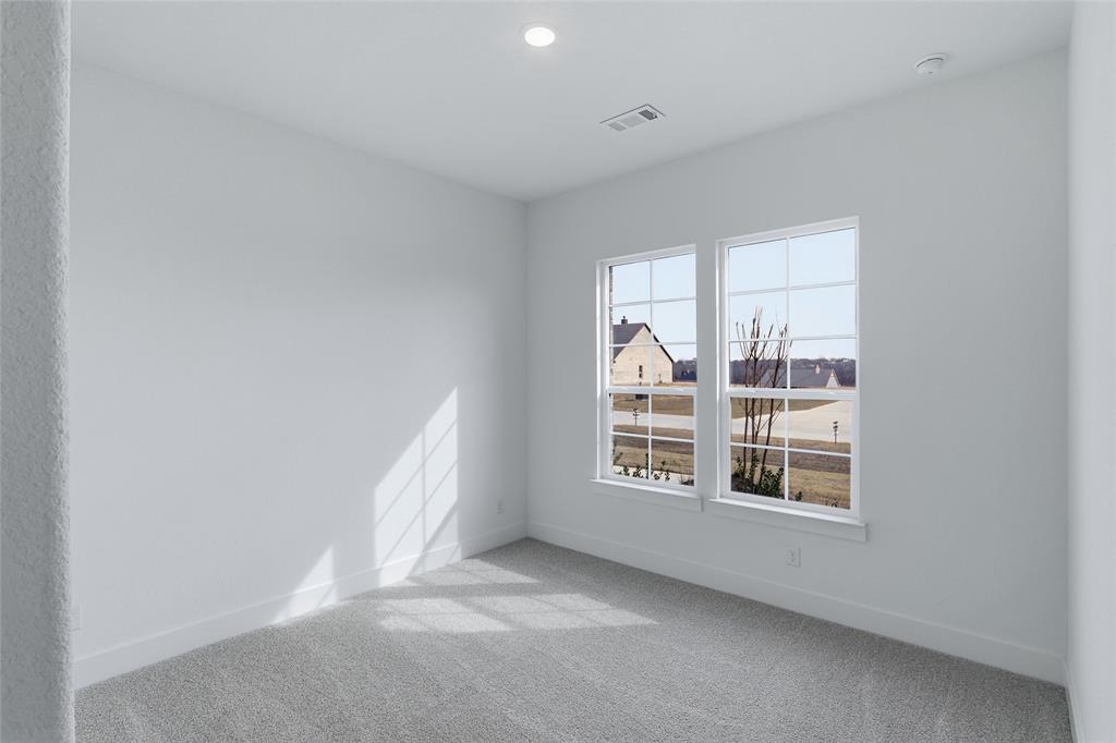 810 Vly Rdg Road Van Alstyne, TX 75495 - Photo 28 of 39 an empty room with windows