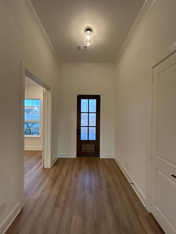 810 Vly Rdg Road Van Alstyne, TX 75495 - Photo 3 of 13 wooden floor in an empty room with a window