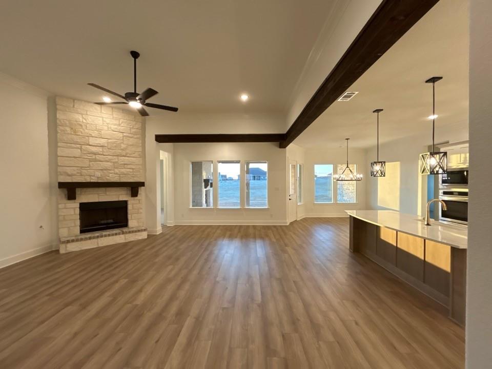 810 Vly Rdg Road Van Alstyne, TX 75495 - Photo 4 of 13 a view of an empty room with window and wooden floor
