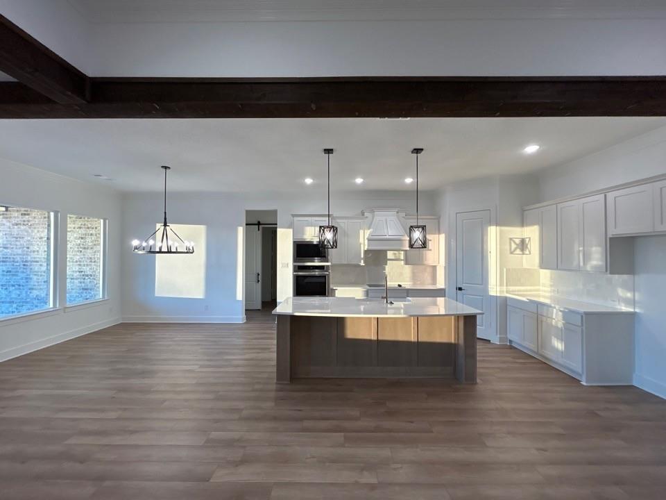 810 Vly Rdg Road Van Alstyne, TX 75495 - Photo 13 of 13 a large kitchen with kitchen island a sink stainless steel appliances and cabinets