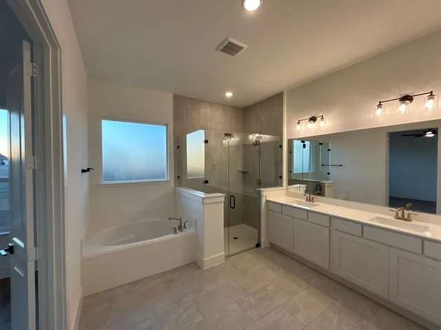 a view of a livingroom with a hardwood floor and a ceiling fan